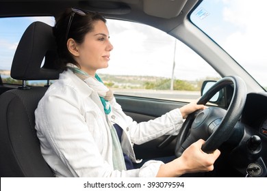 Young Woman Driving A Car