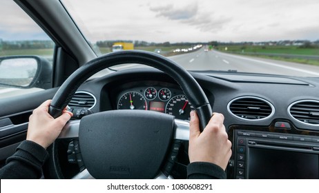 Young Woman Driving Fast Fast Car On Motorway