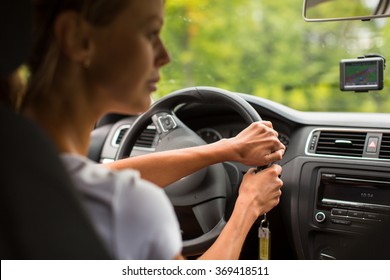 Young Woman Driving Her Car, On Her Way Home From Work - Doing The Daily Commute