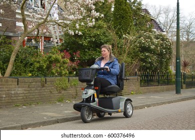 Young Woman Driving Her Mobility Scooter