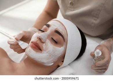 Young woman during face peeling procedure in salon - Shutterstock ID 2005959671