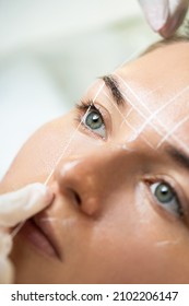 Young Woman During Professional Eyebrow Mapping Procedure Before Permanent Makeup