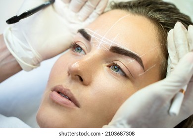 Young Woman During Professional Eyebrow Mapping Procedure