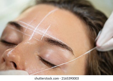 Young Woman During Professional Eyebrow Mapping Procedure Before Permanent Makeup