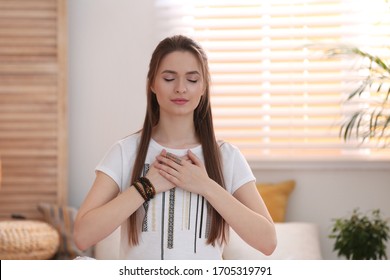 Young woman during self-healing session in therapy room - Powered by Shutterstock