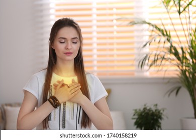 Young woman during self-healing session in therapy room - Shutterstock ID 1740158219