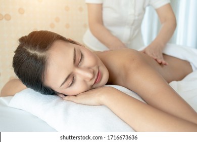 Young Woman during Spa Salon. Woman Relaxes in the spa. Spa Body massage woman Hands Treatment. woman having Thai massage in the spa salon.
