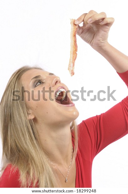 young-woman-eating-bacon-600w-18299248.j