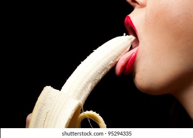 Young Woman Eating Banana