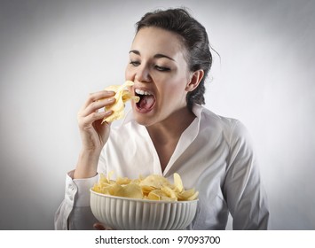 Young Woman Eating Chips