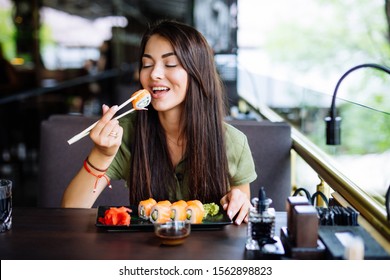Young Woman Eating Enjoying Fresh Sushi Stock Photo 1562898823 ...