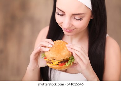 Young Woman Eating Fast Food