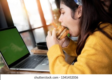 
Young Woman Eating Fatty Hamburger.Craving Fast Food.Enjoying Guilty Pleasure, Eating Junk Food.Satisfied Expression.Breaking Diet Rules,giving Up Diet.Unhealthy Imbalanced Nutrition Calorie Intake.
