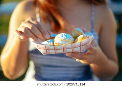 Young Woman Eating Fried Oreos