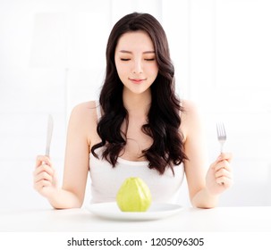 Young Woman Eating Green Guava Fruit 