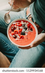 Young Woman Eating Healthy Detox Smoothie Bowl With Berries. View From Above. Lifestyle. Healthy Detox Weight Loss Concept