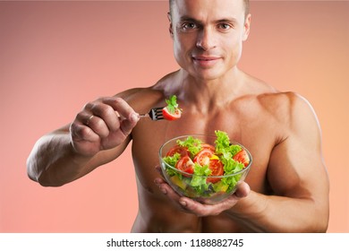Young woman eating a healthy fruit salad - Shutterstock ID 1188882745