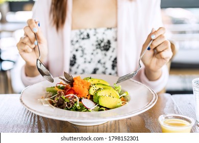 Young woman eating healthy salad at restuarant, Healthy lifestyle, diet concept - Shutterstock ID 1798152301