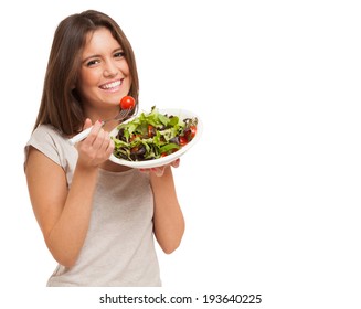 Young Woman Eating A Healthy Salad