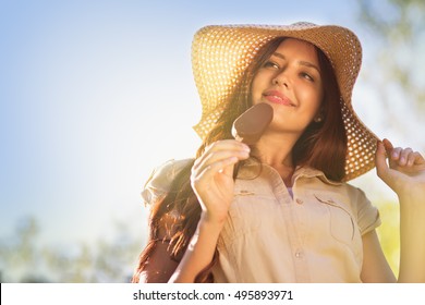 Young Woman Eating Ice Cream In The Park, Woman Eating A Popsicle In Nature