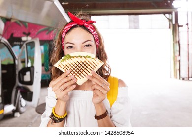 Young Woman Eating Pita Gyros Fastfood In Street Cafe