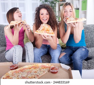 young woman eating pizza at home - Powered by Shutterstock