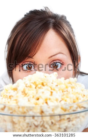 Young woman eating popcorn isolated on white background