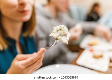 Young Woman Eating Tortellini Ravioli And Dumplings In Restaurant