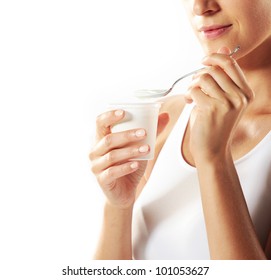 Young Woman Eating Yogurt , Close Up