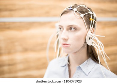 Young Woman With Eeg Electrodes All Around Her Head Having Medical Test Of Brain Activity