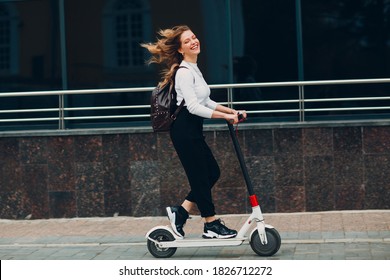 Young woman with electric scooter at the city - Powered by Shutterstock