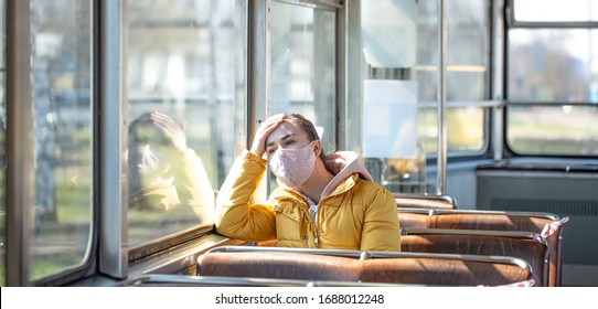 A Young Woman In An Empty Public Transport During The Pandemic. Coronavirus.