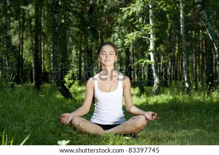 Similar – Young woman doing yoga in nature