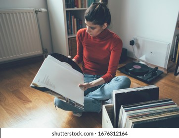 Young Woman Enjoy Her Vinyl Records Collection