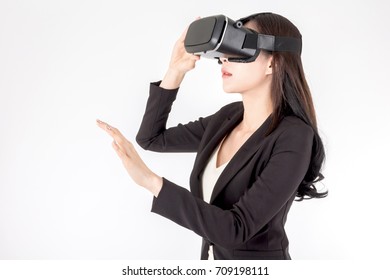 Young woman enjoy with virtual reality glasses on white background - Powered by Shutterstock