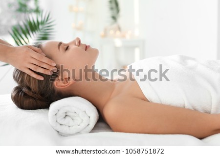 Young woman enjoying massage in spa salon Zdjęcia stock © 