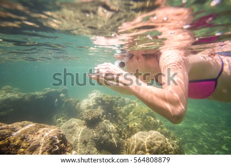 Young woman enjoying reef in Indian Ocean, Kenya