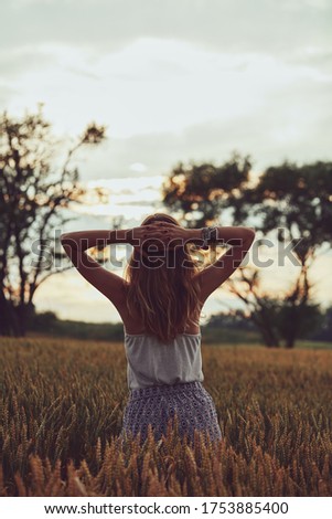 Similar – Image, Stock Photo Woman, both hands in the hair, back view