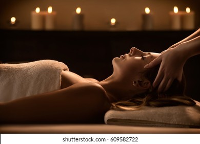 Young woman enjoys massage in a luxury spa resort