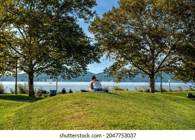 A Young Woman Enjoys The Peaceful Quiet Of The Hudson River Walk Park In Tarrytown New York.