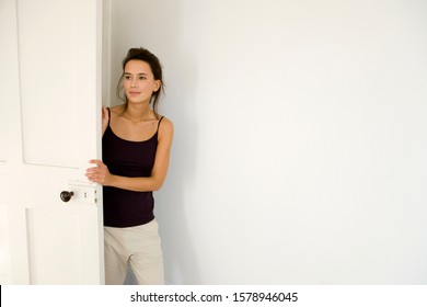 A Young Woman Entering A Room