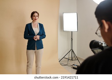 Young Woman In Evening Wear Posing For Fashion Catalog In Studio