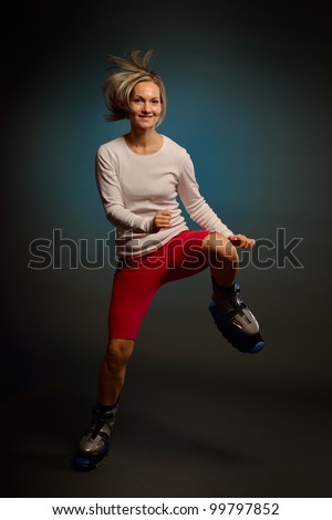 Similar – Close up front upper body portrait of one middle age athletic woman in sportswear in gym over dark background, looking at camera and smiling