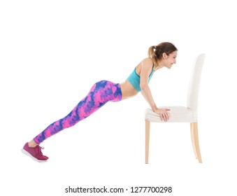 Young woman exercising with chair on white background. Home fitness