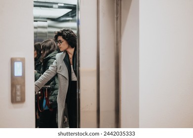 Young woman exiting elevator into busy urban environment, contemplative. - Powered by Shutterstock