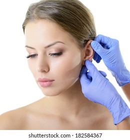 Young woman face with beauty treatment ear plastic isolated  - Shutterstock ID 182584367