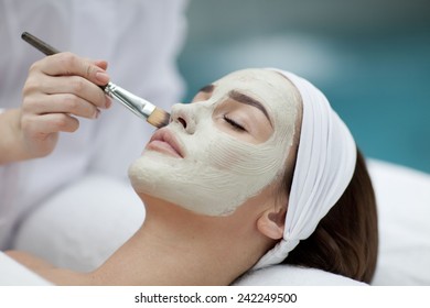 A Young Woman With A Face Pack. 