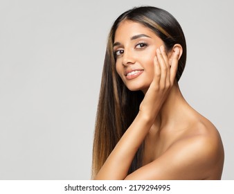 Young Woman Face Portrait. Beauty Model touching Cheekbones. Women Facial Skin Care and Facelift Treatment over White background. Smiling Fashion Girl with smooth Makeup - Shutterstock ID 2179294995