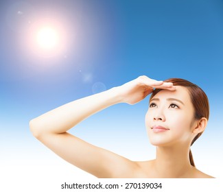 young woman face with sunlight background