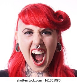 young woman with facial piercings screaming